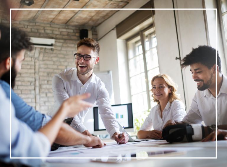 Group of business people chatting around a table